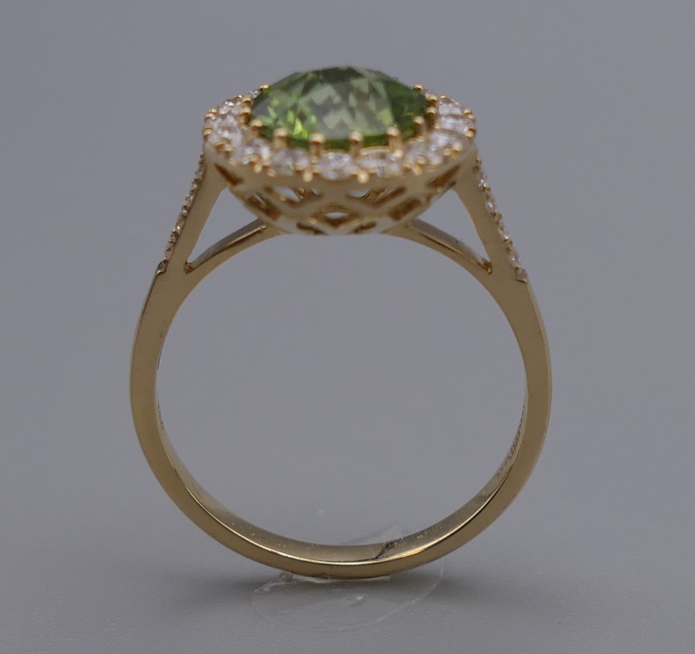 An 18 ct gold, peridot and diamond ring with diamond shoulders. Ring Size M. 3. - Image 2 of 6