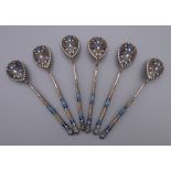 Six enamel decorated silver Russian teaspoons. Each 10.5 cm long. 79.4 grammes total weight.