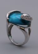 A silver blue stone ring. Ring Size L.