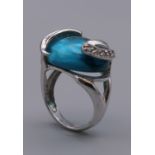 A silver blue stone ring. Ring Size L.