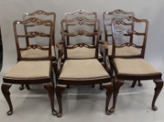 A set of six mahogany ladder back chairs, including two carvers. The carvers 58 cm wide.