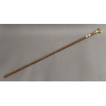 A Victorian walking stick with ivory dog's head handle. 86 cm long.