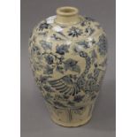 A Vietnamese blue and white pottery vase. 30 cm high.