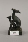 A bronze double deer's seal. 12 cm high.