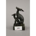 A bronze double deer's seal. 12 cm high.