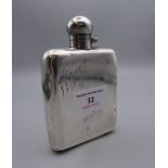 A silver hip flask. 12.5 cm high. 4.4 troy ounces.