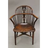 A 19th century Windsor chair (adapted). 62 cm wide.