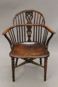 A 19th century Windsor chair (adapted). 62 cm wide.