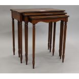 A modern nest of three mahogany tables. 66 cm wide.