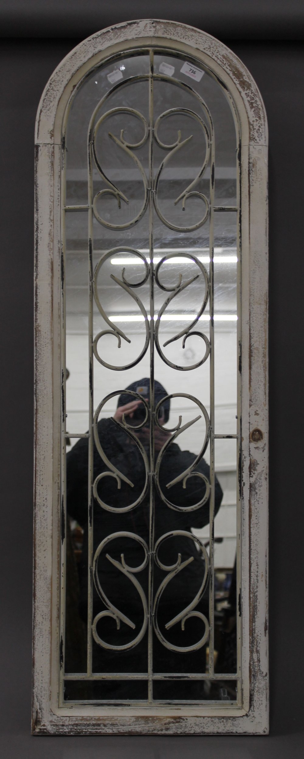 A white painted arch mirror. 123.5 cm high.