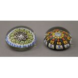 Two rounded millefiori paperweights. The largest 5 cm high.