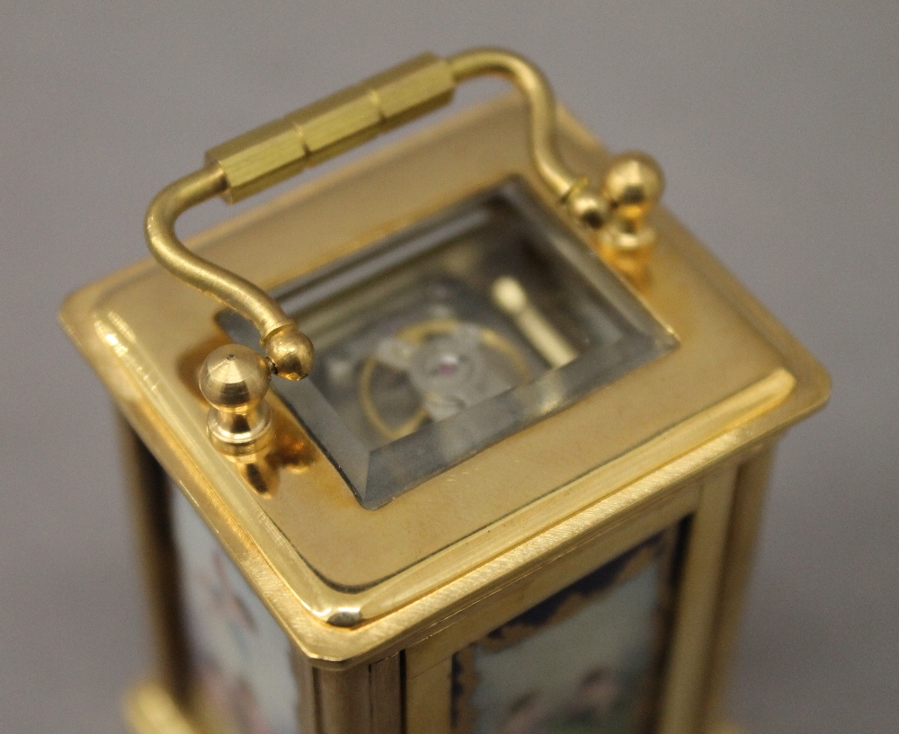 A miniature carriage clock with porcelain panels. 7.5 cm high. - Image 6 of 9