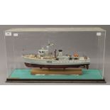 A cased scale model of the mine sweeper HMS Appleton. The case 60.5 cm long.