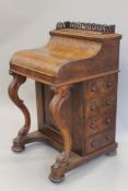 A Victorian walnut piano top Davenport. 57.5 cm wide.