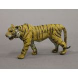 A cold painted bronze model of a tiger. 10.5 cm long.