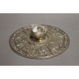 An Arts and Crafts silver plated circular inkwell. 22 cm diameter.