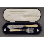 A cased pair of Victorian silver and ivory handled fish servers. 7.5 troy ounces total weight.
