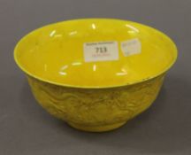 A Chinese porcelain yellow bowl. 15.5 cm diameter.