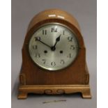 An early 20th century oak mantle clock. 32 cm high.