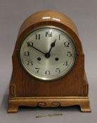 An early 20th century oak mantle clock. 32 cm high.