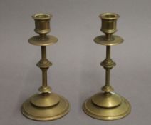 A pair of brass candlesticks. 18.5 cm high.