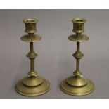 A pair of brass candlesticks. 18.5 cm high.