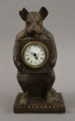 A wooden bear clock. 30 cm high.