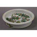 A Chinese famille verte porcelain dish. 21 cm diameter.