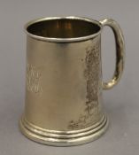 A small silver mug. 7 cm high. 2.3 troy ounces.
