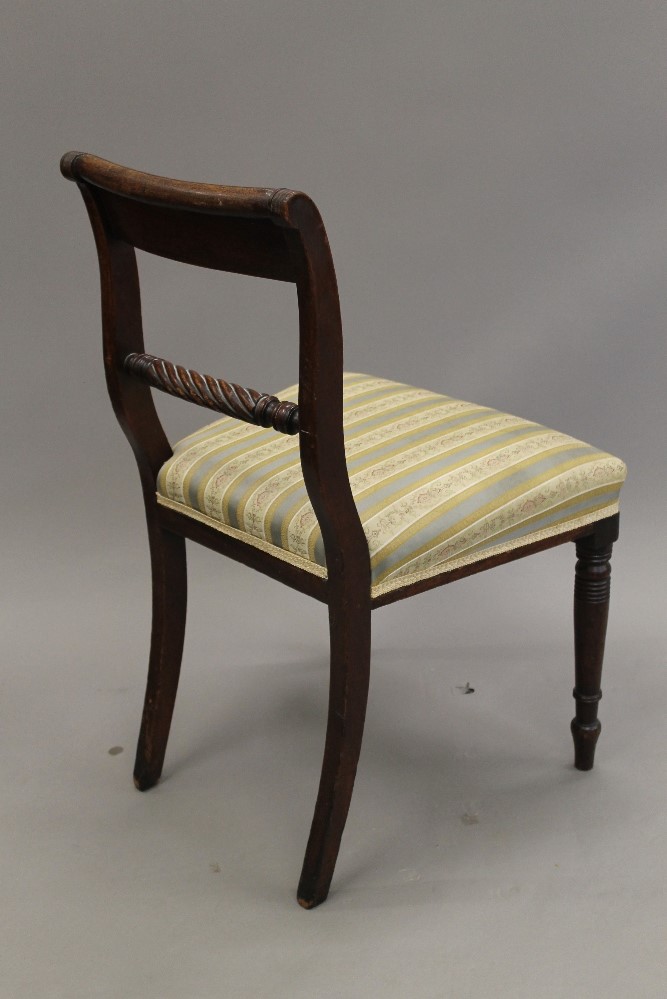 A set of four 19th century mahogany dining chairs. 48 cm wide.