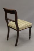 A set of four 19th century mahogany dining chairs. 48 cm wide.