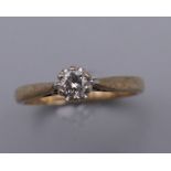 A 9 ct gold diamond solitaire ring. Ring Size N/O. 2.1 grammes total weight.
