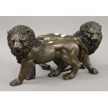 A pair of bronze lions. 31 cm long.