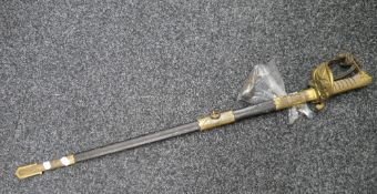 A Royal Naval Volunteer Reserve (RNVR) officers sword, in scabbard. 96 cm long.