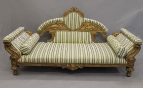 A 19th century upholstered gilt wood settee. 208 cm long.