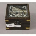 A boxed model sextant. 11 cm wide overall.