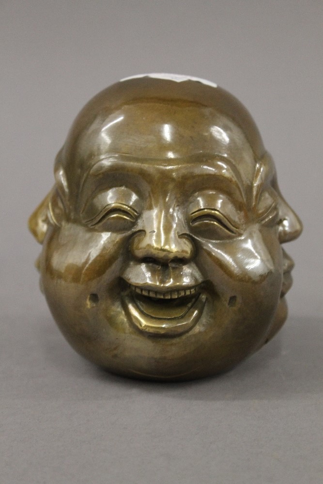 A bronze four faced buddha head. 11 cm high. - Image 2 of 3