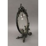 A Rococo style bronzed cast metal dressing table mirror. 44 cm high.