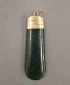 A 15 ct gold mounted jade pendant. 4.5 cm high.