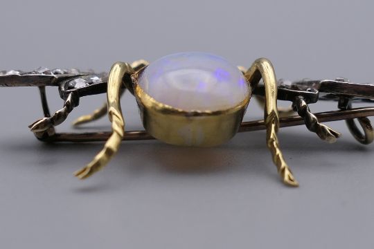 An unmarked gold diamond, opal and ruby brooch formed as a fly. 4.5 cm wide. 10. - Image 8 of 10