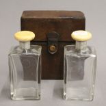 A pair of early 20th century ivory and silver mounted bottles in an Asprey fitted leather case.