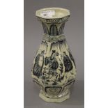 A Chinese blue and white porcelain vase decorated with people. 28 cm high.