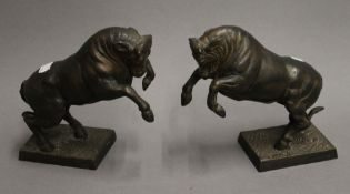 A pair of patinated bronze bulls, signed FARBEL. 18 cm high.