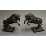 A pair of patinated bronze bulls, signed FARBEL. 18 cm high.