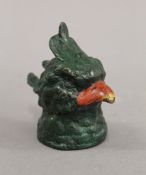 A cold painted bronze inkwell in the form of a parrot. 8.5 cm high.