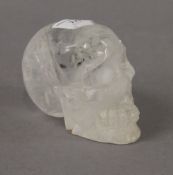 A rock crystal skull. 8 cm high.