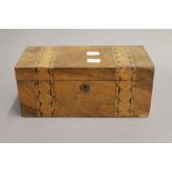 A Victorian inlaid walnut tea caddy. 25 cm wide.