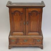 An 18th century, possibly Colonial/American walnut table cabinet. 77 cm high x 58 cm wide.