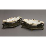 A pair of 19th century porcelain mounted bronze swan form table servers. 28 cm long.