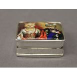 A silver pill box depicting cats. 3 cm wide.